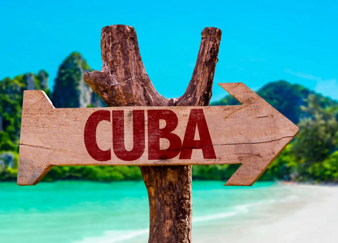 Picture showing sign of Cuba on beach