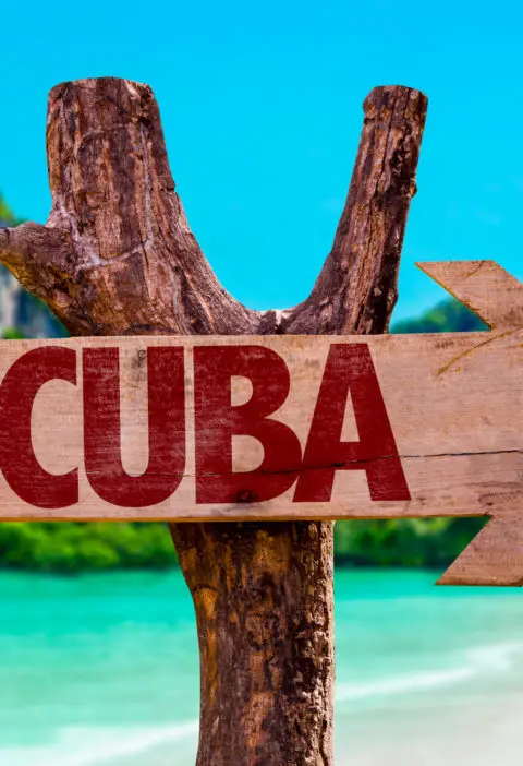Picture showing sign of Cuba on beach