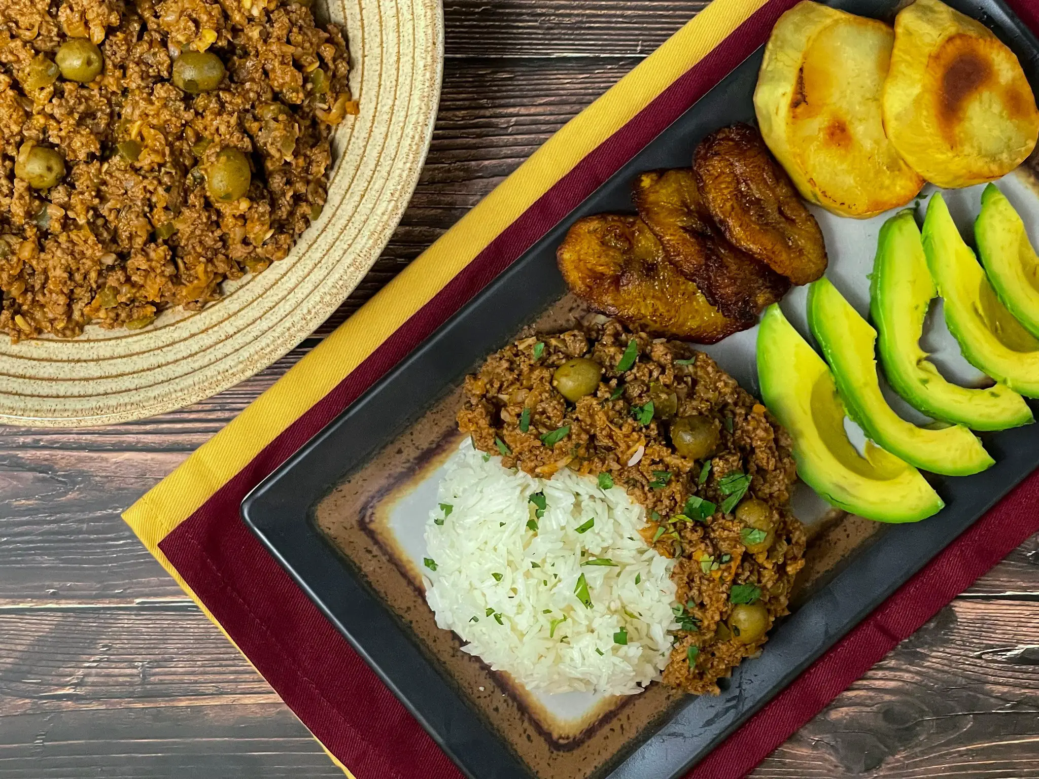 Cuban picadillo pictured with sides.