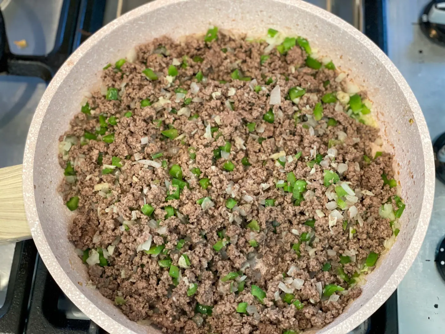 Ground beef cooking with sofrito.