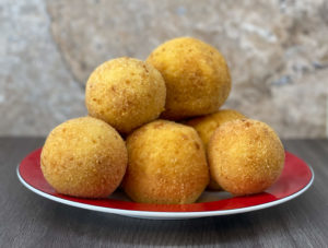 Cuban papa rellena on a plate. 