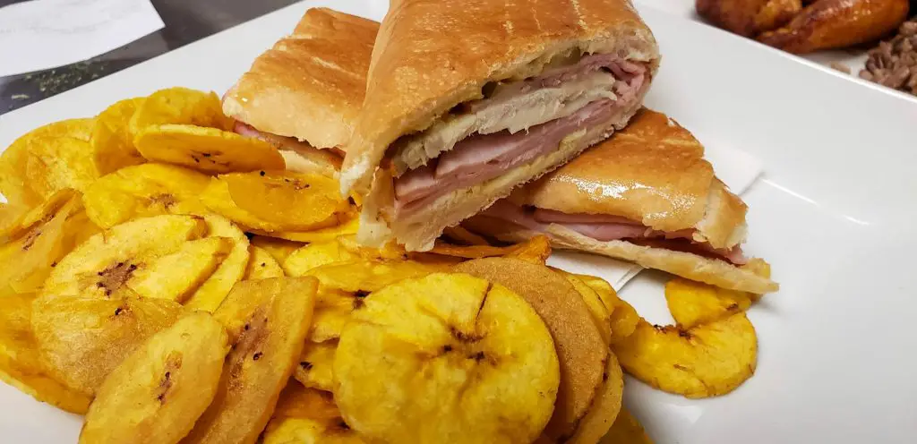 A Cubano cut in half served with plantain chips from Flor de Cuba restaurant.