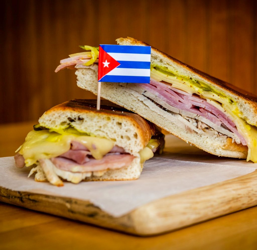 A Cuban sandwich cut in half from El Artesano.