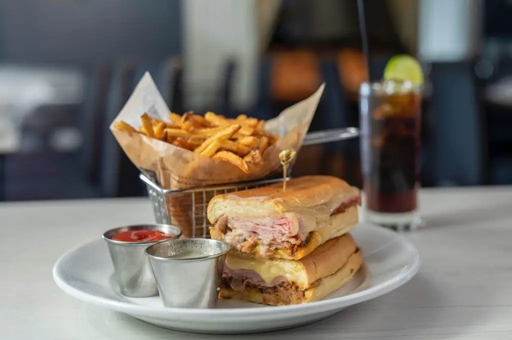 A Cuban sandwich served with French fries at Son Cubano.