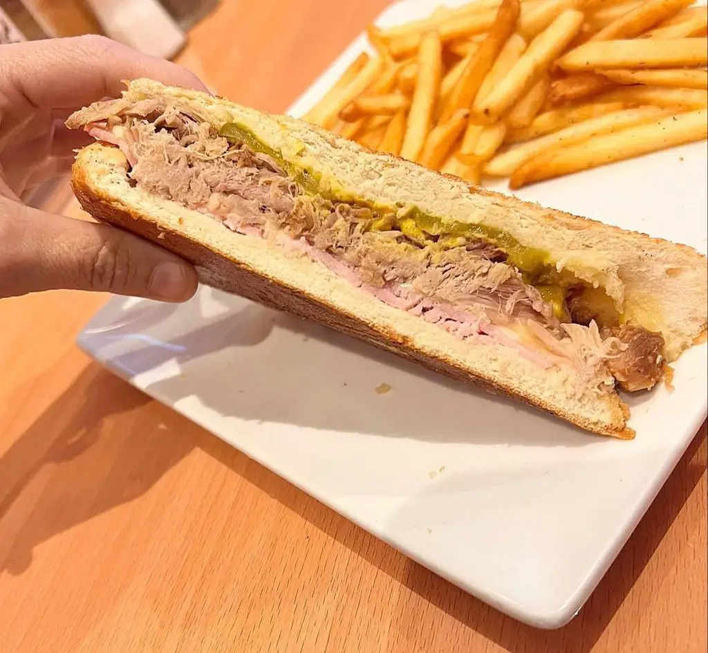 Half of a Cuban sandwich and French fries from Cuba Bella Cafe.