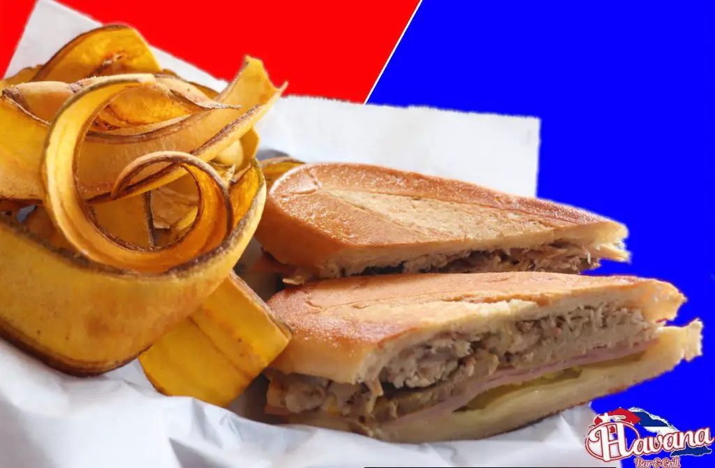 A Cuban sandwich cut in half served with plantain banana strips from Havana Bar and Grill.