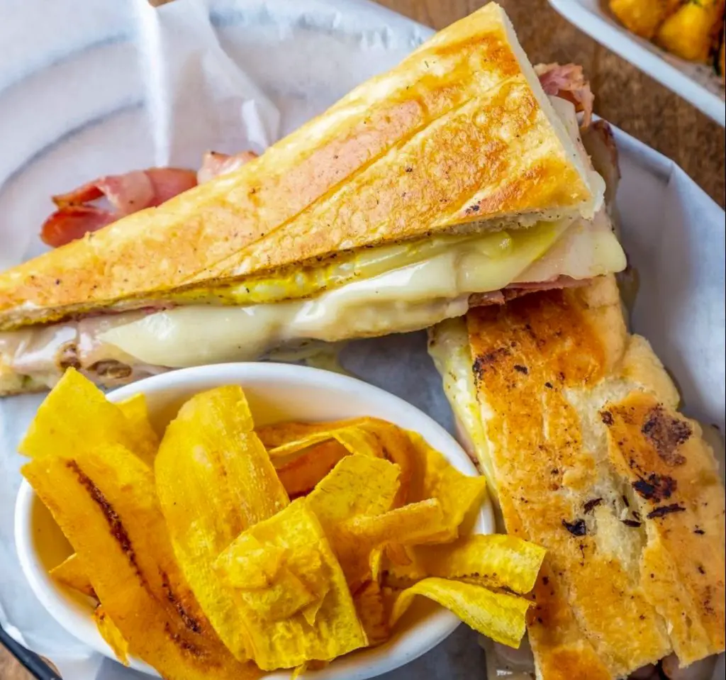 A Cubano cut in half served with plantain strips from Havana Grill.