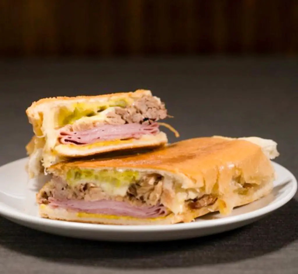 The Cuban sandwich from The Tropicana Cuban Restaurant served on a plate.