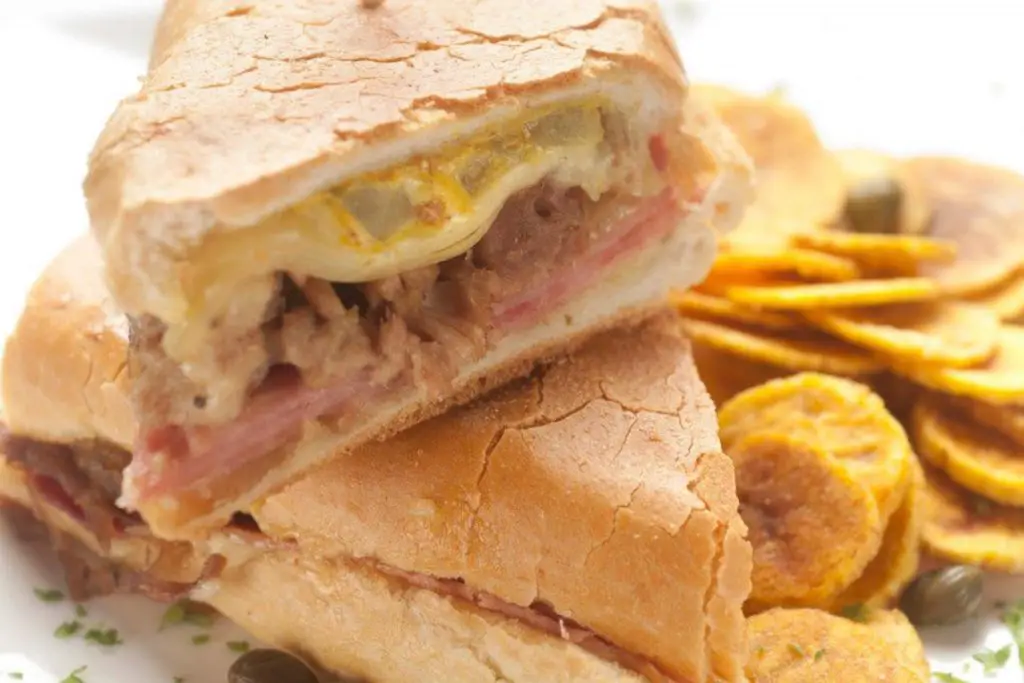 A Cuban sandwich from Amor Cubano served with some plantain chips.