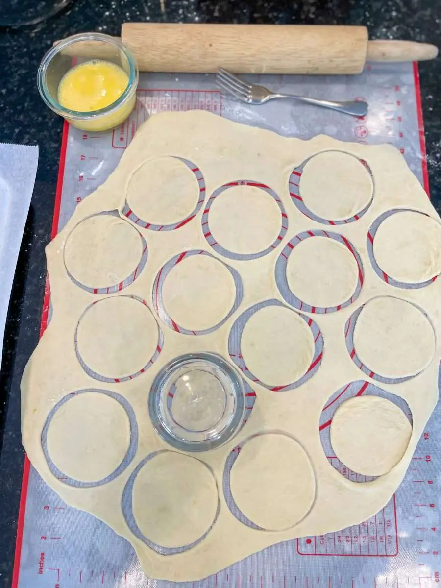 Empanada dough rolled out and cut into discs.