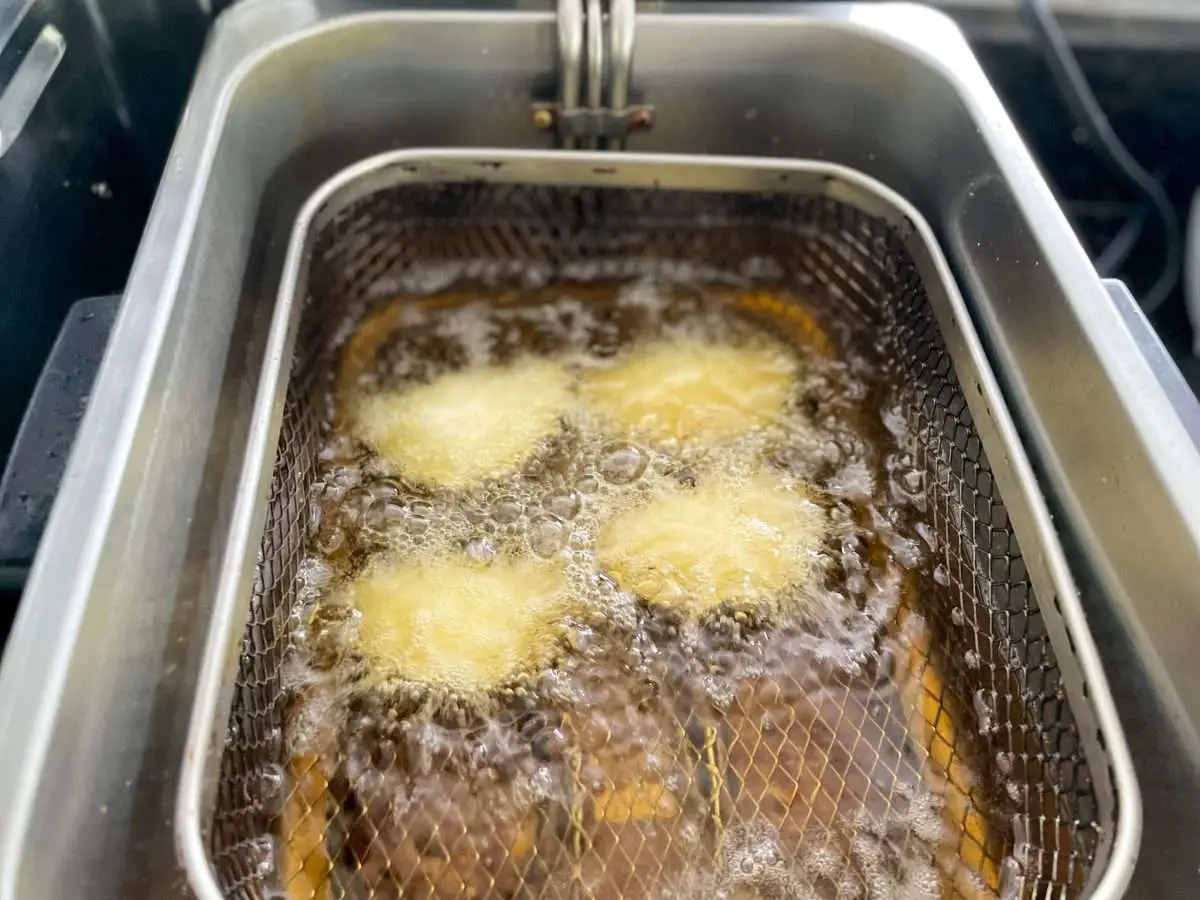 Frying empanadas in oil at 350 degrees.