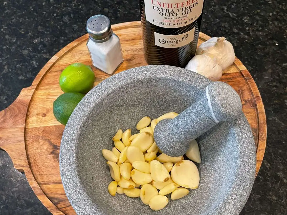 Garlic mojo ingredients, garlic, limes, salt and olive oil.