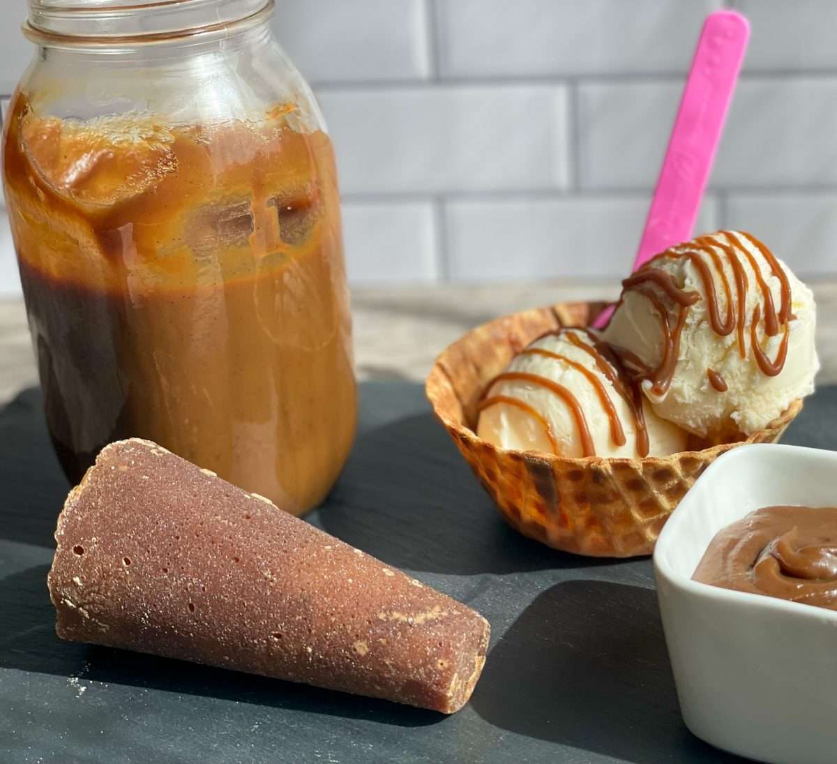 A jar of Dulce de leche, piloncillo and ice cream.