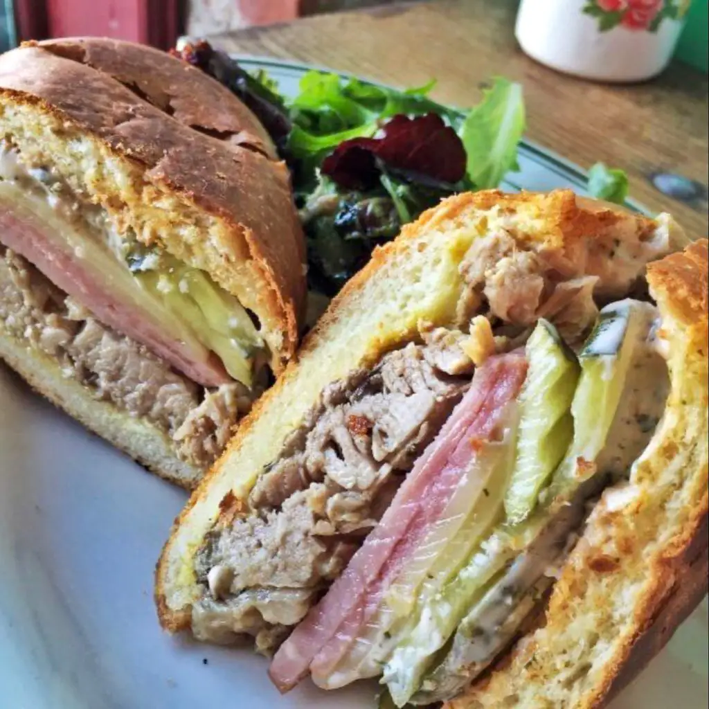 A Cuban sandwich served with a green salad from Parada 22 restaurant.