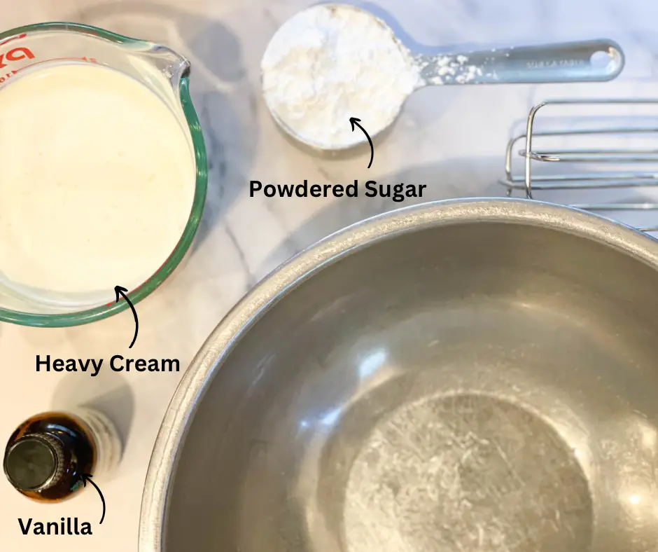 Ingredients for whipped cream. They are powdered sugar, heavy cream and vanilla.