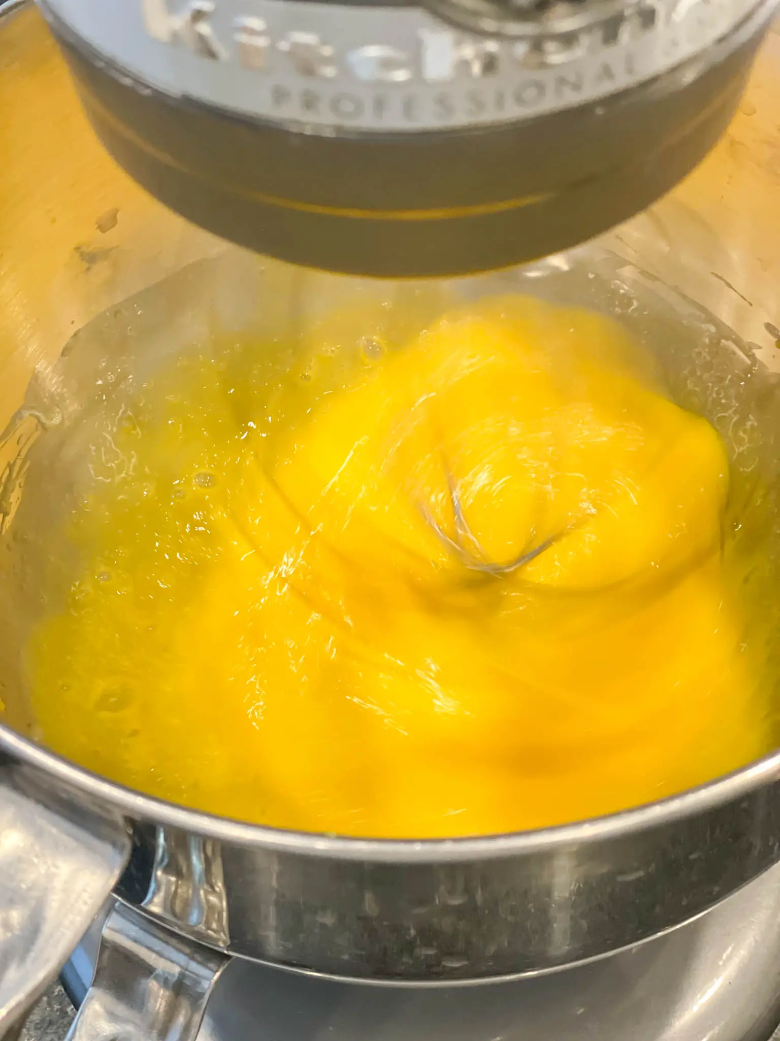 Whipping eggs in mixing bowl.